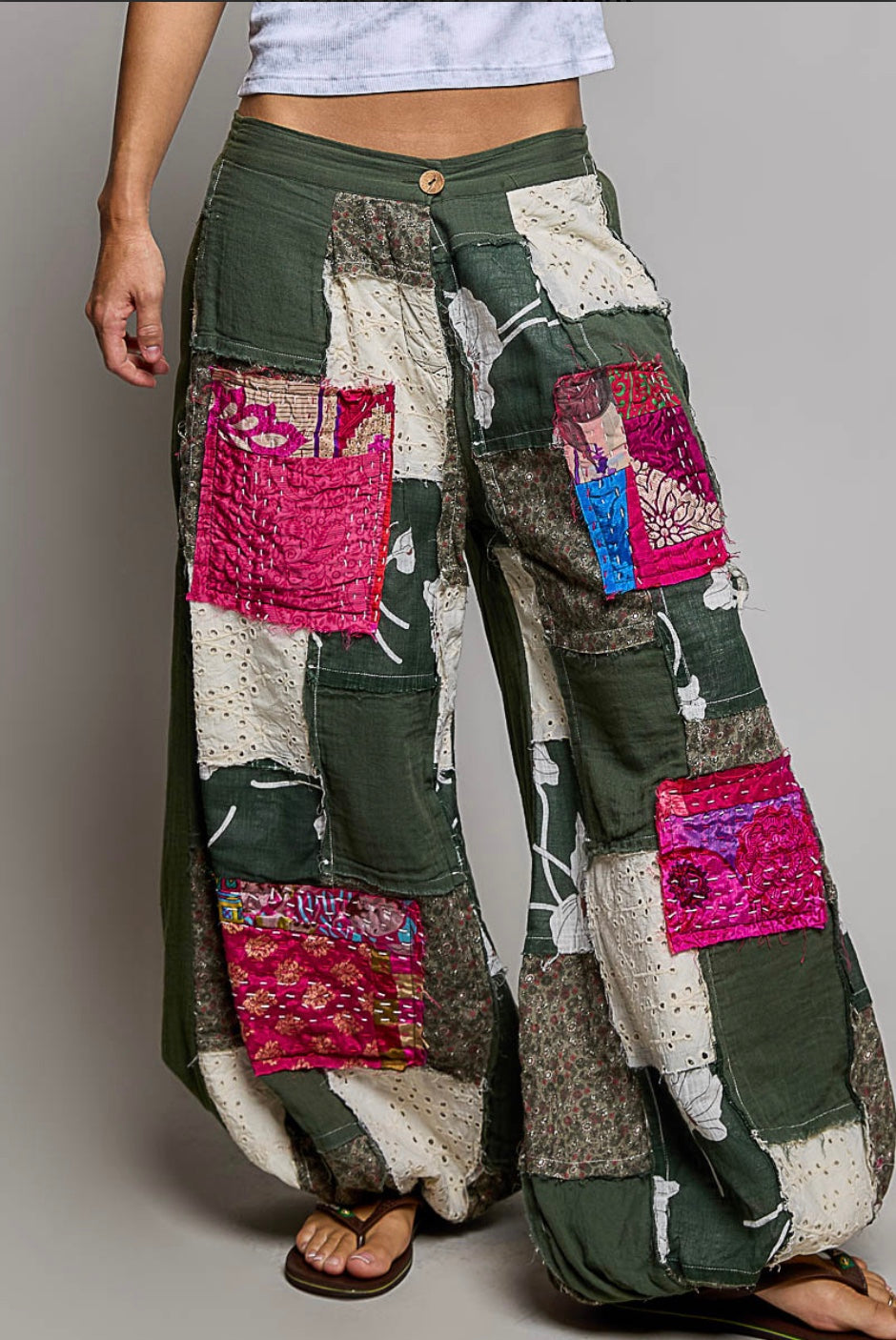 Close-up of floral, eyelet and colorful patchwork details