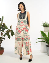 Front view of model wearing the Poppy vintage feed sack wide-leg jumpsuit