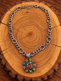 Rainbow Crystal Flower Necklace – Silver Mixed-Link Chain on warm golden wood
