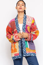 Close front view showing the Kantha jacket patchwork and blue block-print trim