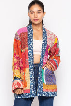 Model wearing the colorful reversible Kantha quilted sari jacket, front view