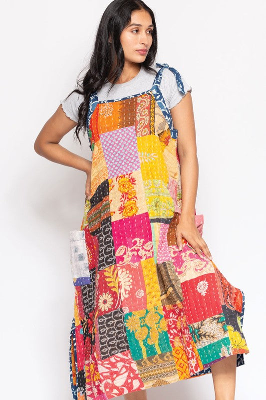 Angled view of the reversible Kantha patchwork sundress with side pocket