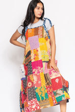 Angled view of the reversible Kantha patchwork sundress with side pocket