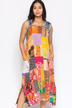 Model wearing the colorful reversible Kantha patchwork sundress, front view