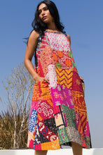 Outdoor lifestyle view of the colorful Kantha patchwork sundress
