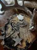 Silver-tone rhinestone star pendant necklace styled on rustic wood
