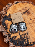 Route 66 earrings on warm wood