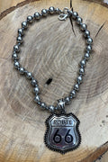Actual Route 66 silver-tone beaded necklace photographed on wood