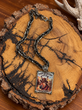 Sassy by Nature donkey pendant necklace with chunky antiqued chain on rustic wood