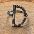 Silver-tone snaffle bit rhinestone bracelet on natural wood