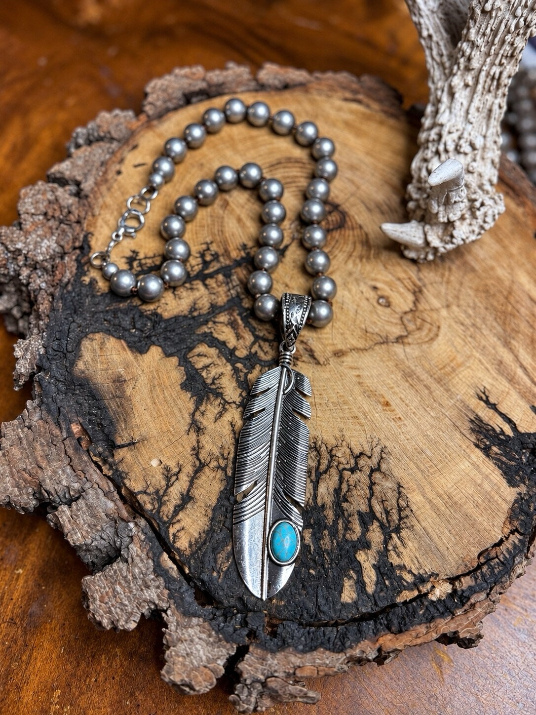 Turquoise feather pendant necklace with hand-knotted silver metal beads