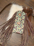 One-of-a-kind purse with brown and white panels, turquoise scrollwork and long brown fringe