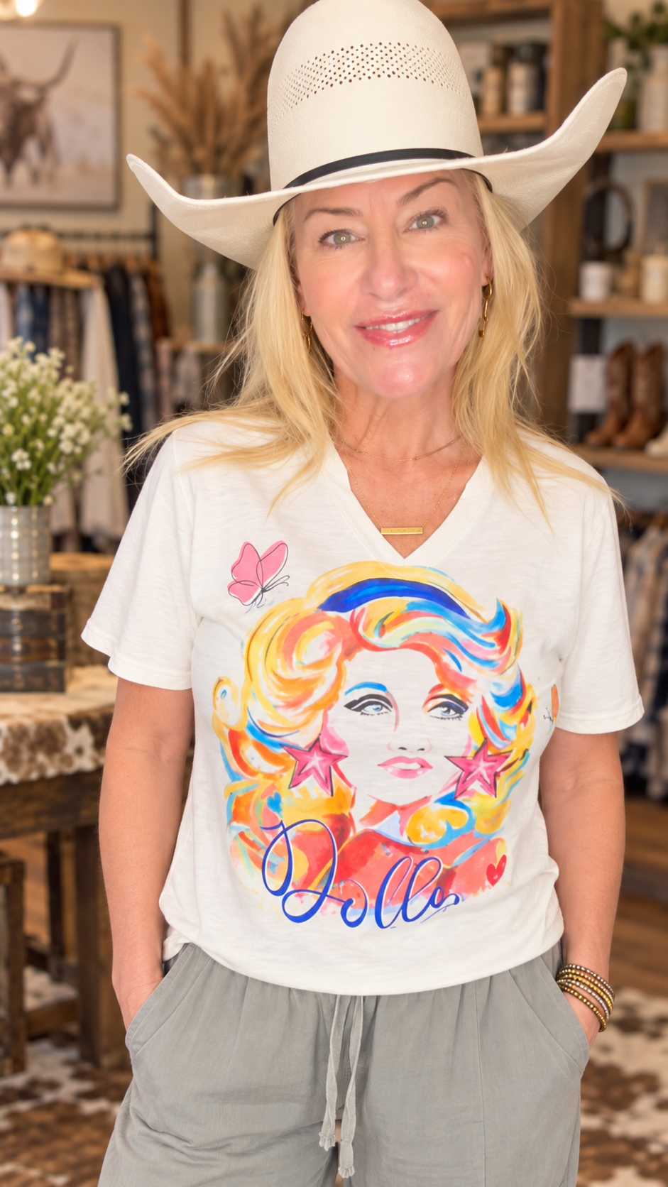 Watercolor Dolly graphic tee modeled with a white cowboy hat