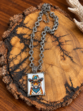 Western tiger portrait pendant necklace with silver-tone double-ring chain on rustic wood