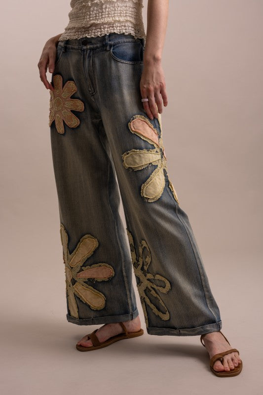 Wildflower patchwork wide-leg denim pants angled front view